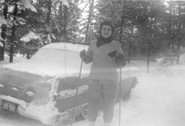 Woodville-born Leola Brintnell poses with skis in front of her car, circa 1957. Leola Brintnell fonds (2023.107), Kawartha Lakes Museum &amp; Archives.